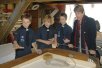 ARC Finance Chairman Wyn Hoadley gets some advice from the Sea Scouts on our Cutter Jellicoe (215)